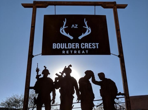 A group standing under the BCF sign