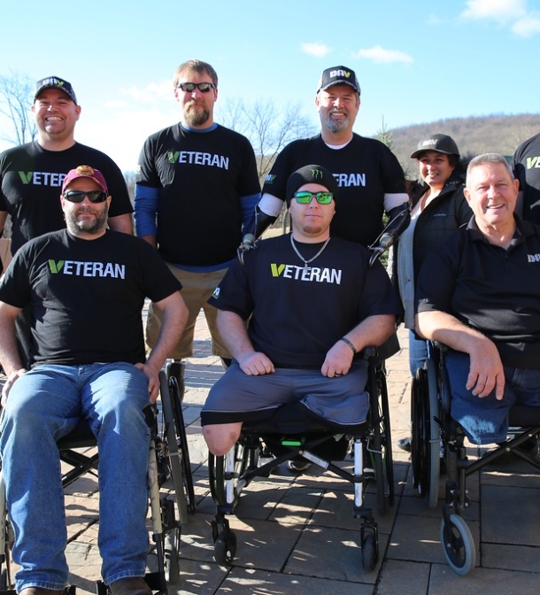 A group of veterans pose for a photo