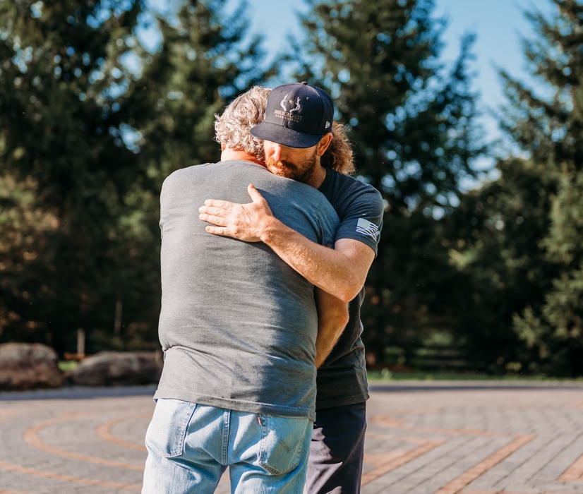 two male veterans hugging boulder crest posttraumatic growth
