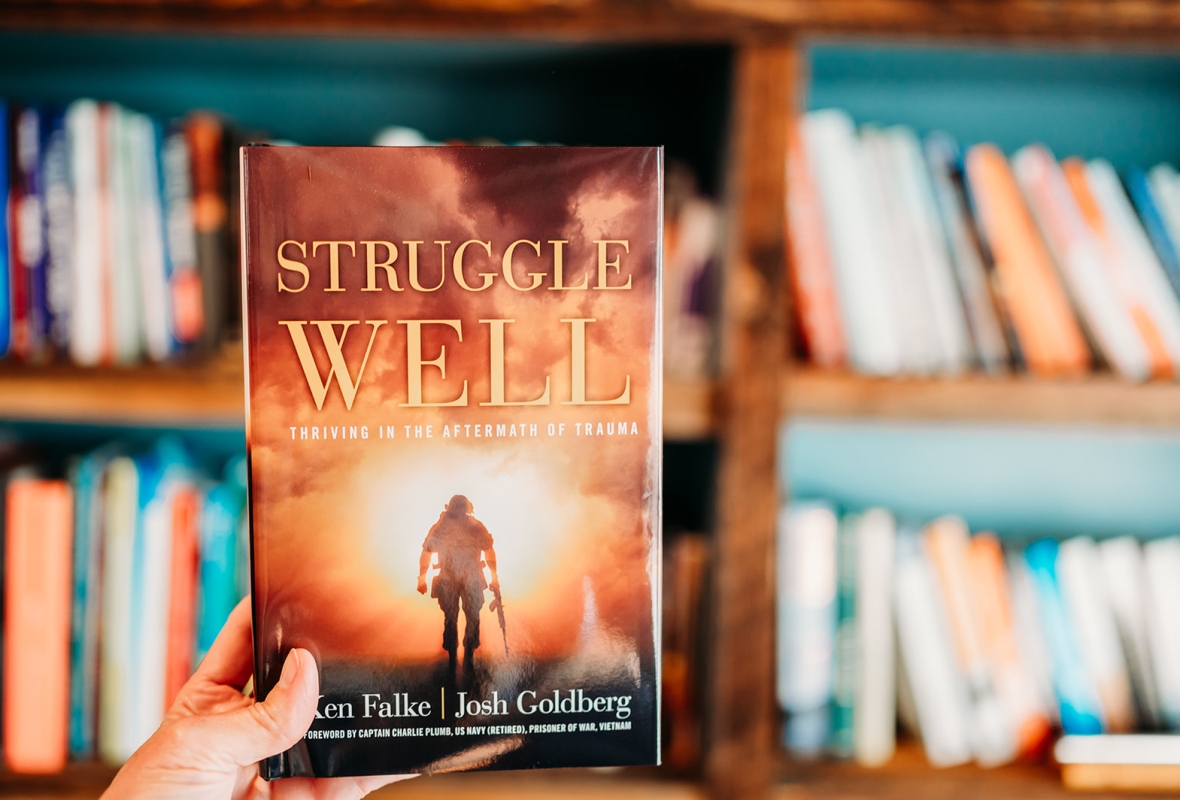 The Struggle Well book held in a hand