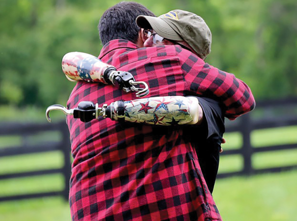 A disabled veteran shares a hug with Josh
