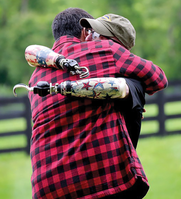 A disabled veteran shares a hug with Josh