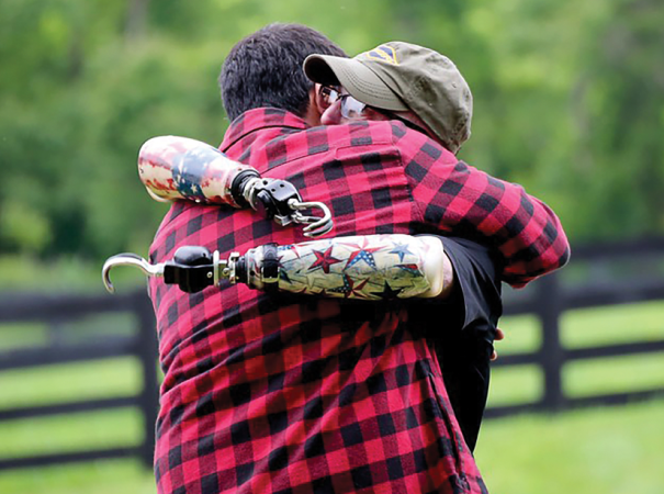 A disabled veteran shares a hug with Josh