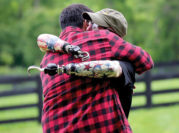 A disabled veteran shares a hug with Josh